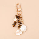 Chaveiro Charm Estrela-do-Mar e Conchas