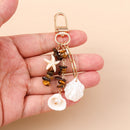 Chaveiro Charm Estrela-do-Mar e Conchas